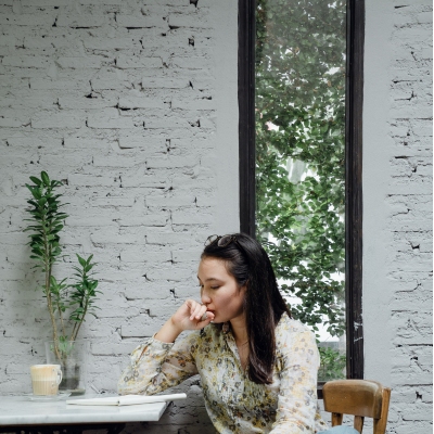 Woman at desk looking decisive